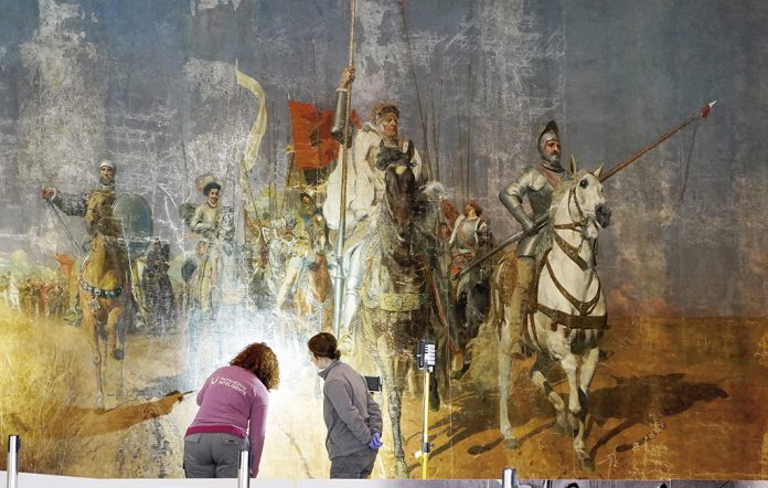 Trabajos de restauración del lienzo ‘Los comuneros de Castilla’ de Juan Planella y Rodríguez. LETICIA PÉREZ.